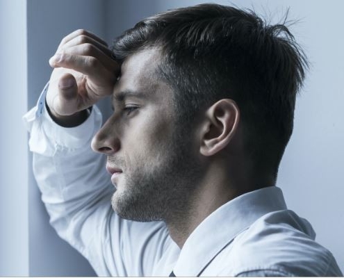 Stressed Man Staring Out Of Window1